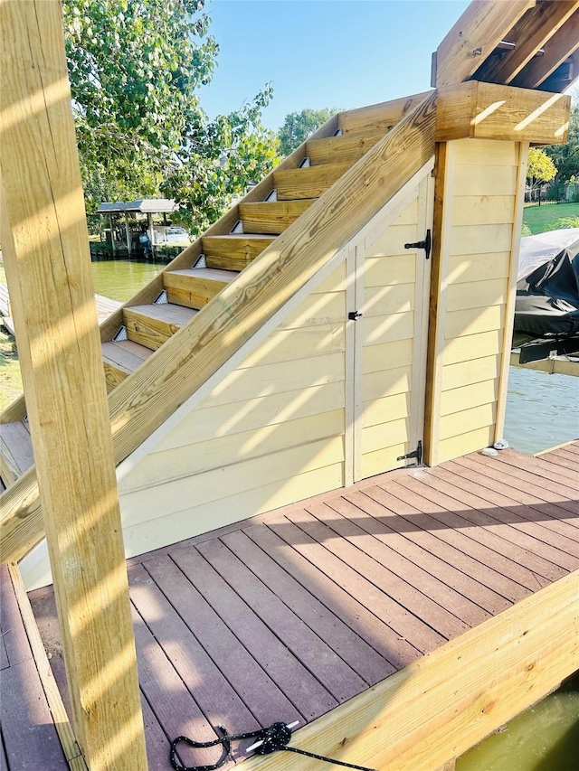 wooden deck with a water view