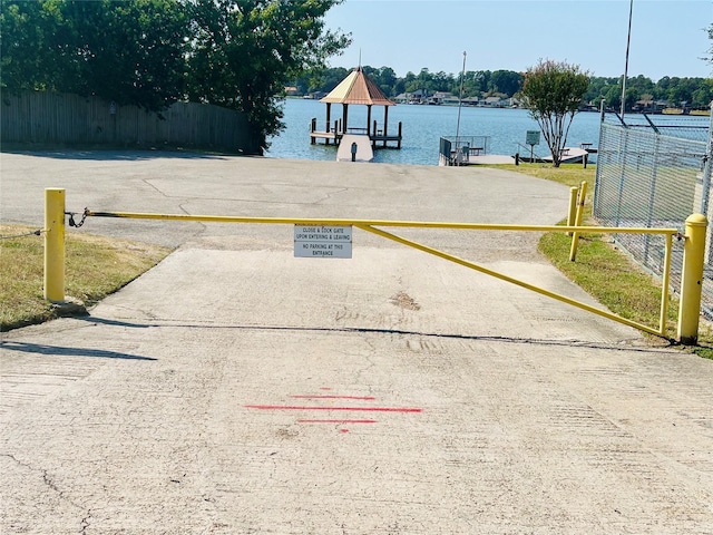 exterior space featuring a water view and a boat dock