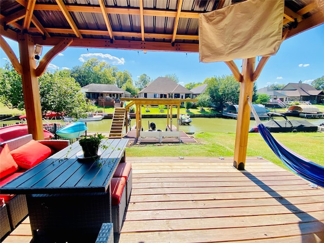 wooden terrace featuring a water view