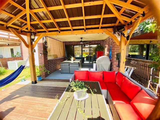 view of patio / terrace with central air condition unit, outdoor lounge area, a wooden deck, ceiling fan, and a gazebo