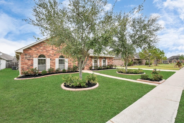 single story home featuring a front yard