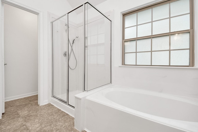 bathroom with tile patterned flooring and plus walk in shower