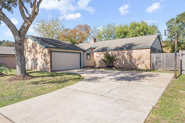 ranch-style house with a front lawn and a garage