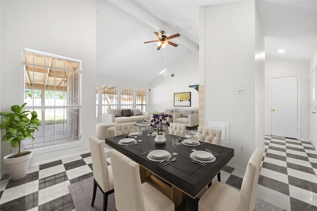 dining room with beamed ceiling, ceiling fan, and high vaulted ceiling