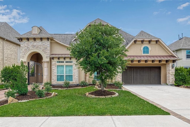 view of front facade with a front lawn and a garage