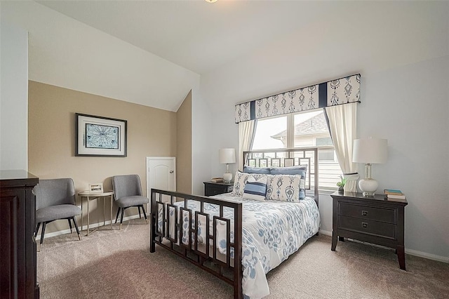 bedroom featuring light colored carpet and lofted ceiling