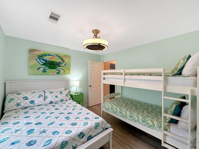 bedroom featuring dark hardwood / wood-style flooring