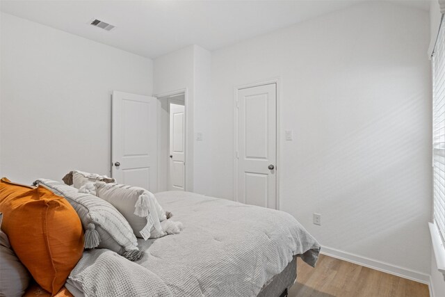 bedroom featuring light hardwood / wood-style floors