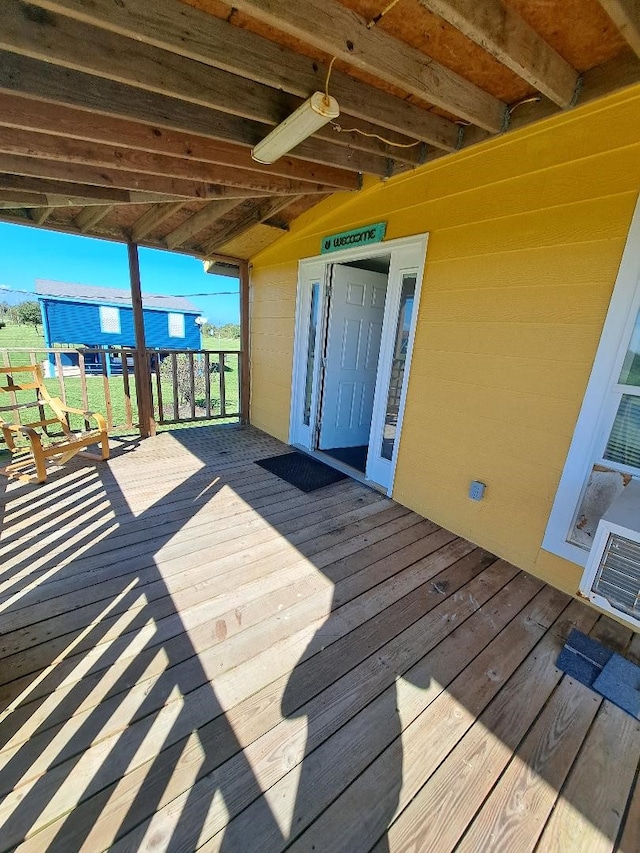 wooden deck featuring ceiling fan