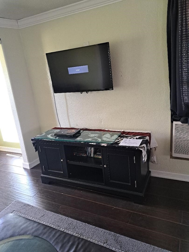 room details with hardwood / wood-style flooring and crown molding