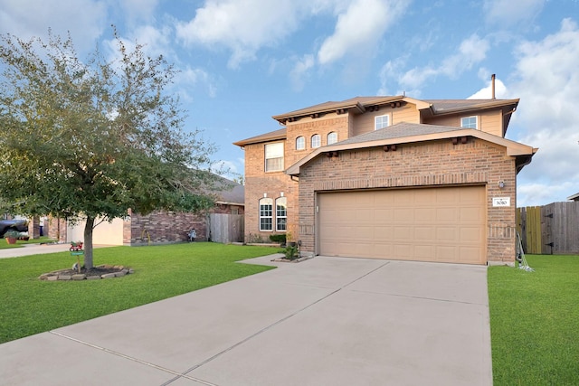 view of front of property with a garage and a front yard