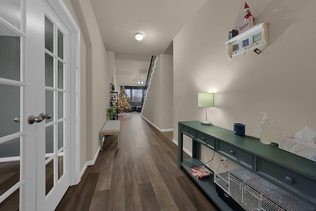 corridor with french doors and dark hardwood / wood-style floors