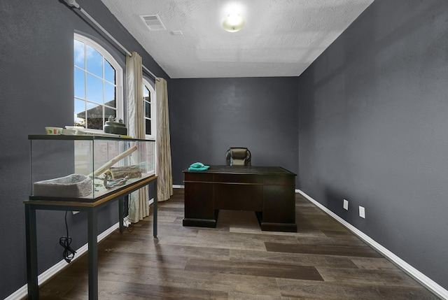 office featuring a textured ceiling and dark hardwood / wood-style flooring