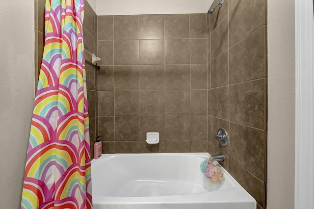 bathroom with shower / tub combo with curtain