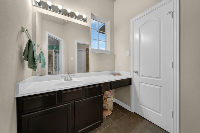 bathroom featuring tile patterned floors and vanity