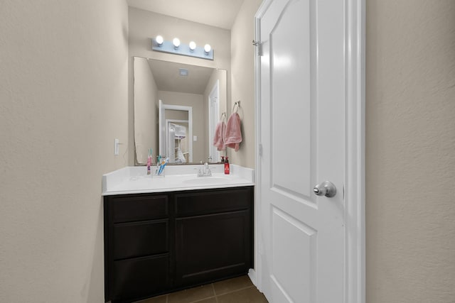 bathroom with vanity and tile patterned floors