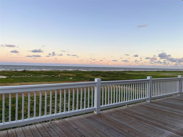 deck at dusk with a water view