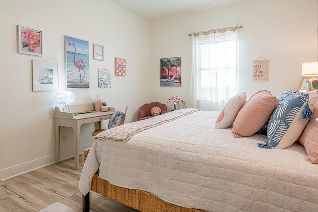 bedroom with light hardwood / wood-style floors