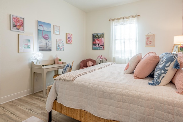 bedroom with light hardwood / wood-style flooring