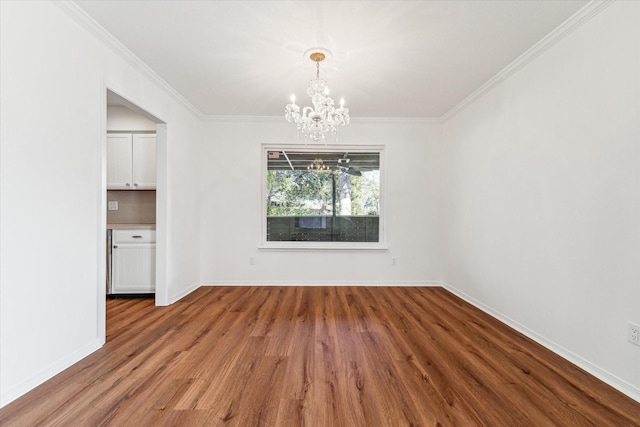 unfurnished dining area featuring a chandelier, ornamental molding, and hardwood / wood-style floors