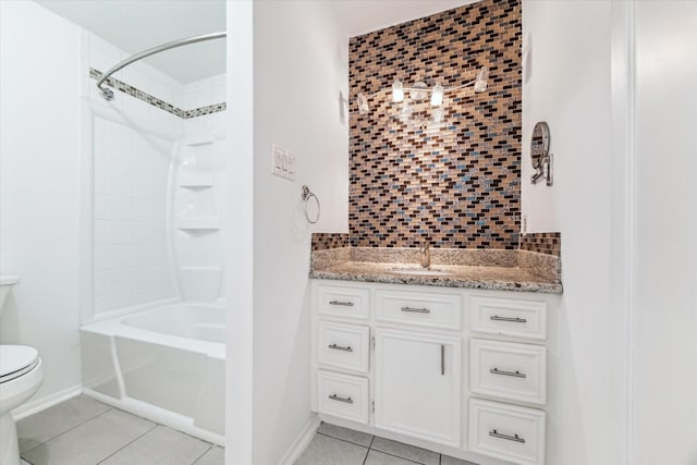 full bathroom featuring bathing tub / shower combination, tile patterned floors, vanity, tasteful backsplash, and toilet