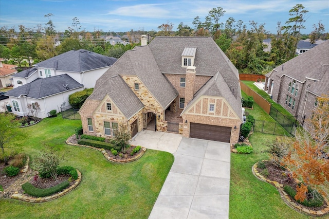 view of front of house featuring a front lawn and a garage