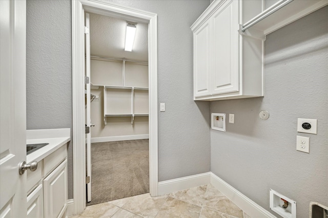 laundry area with hookup for a washing machine, cabinets, hookup for an electric dryer, and light colored carpet