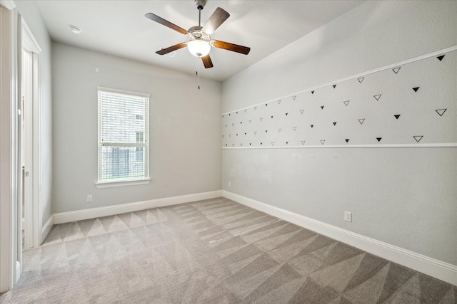 carpeted empty room with ceiling fan