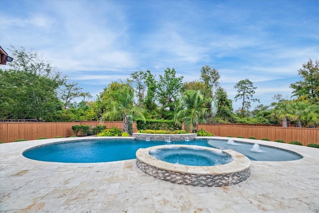 view of swimming pool with pool water feature, an in ground hot tub, and a patio area