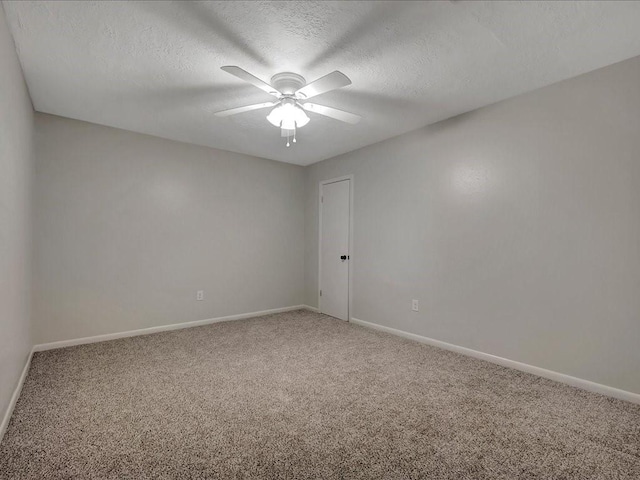 unfurnished room featuring carpet flooring, ceiling fan, and a textured ceiling