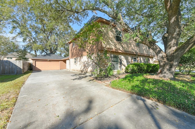 view of front of home featuring a garage and a front lawn