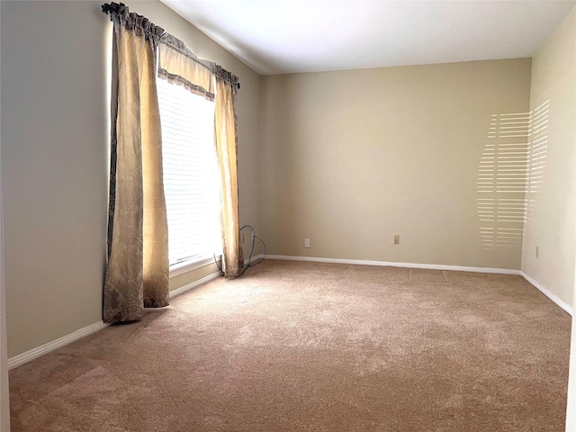 carpeted spare room with plenty of natural light