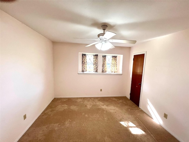 carpeted empty room with ceiling fan