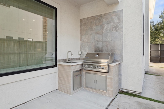 view of patio / terrace with area for grilling, sink, and grilling area