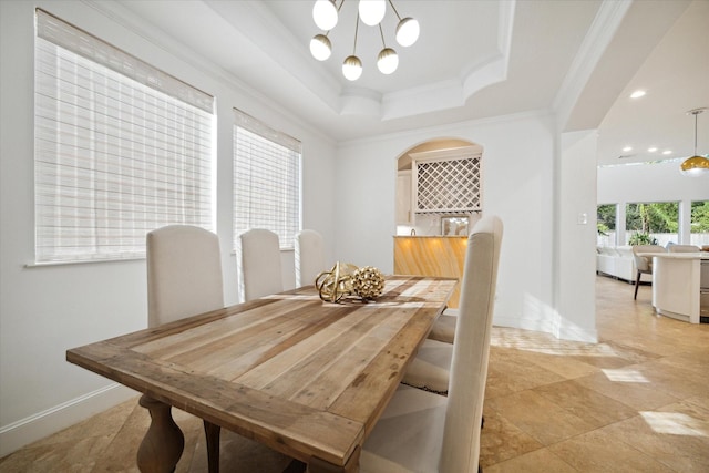 1406 Sue Barnett Dr, Houston, TX 77018 - dining space featuring crown molding, a raised ceiling, baseboards, a chandelier, and arched walkways