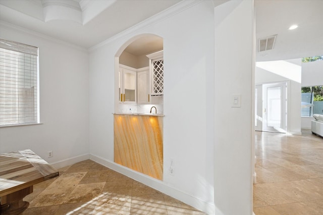 interior space with crown molding