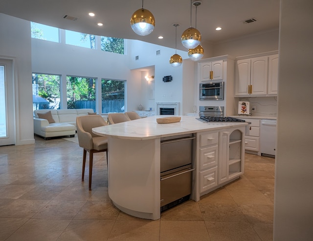 1406 Sue Barnett Dr, Houston, TX 77018 - kitchen with white dishwasher, white cabinets, plenty of natural light, recessed lighting, and a towering ceiling