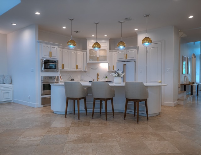 1406 Sue Barnett Dr, Houston, TX 77018 - kitchen featuring stainless steel appliances, a center island, white cabinetry, a breakfast bar, and recessed lighting