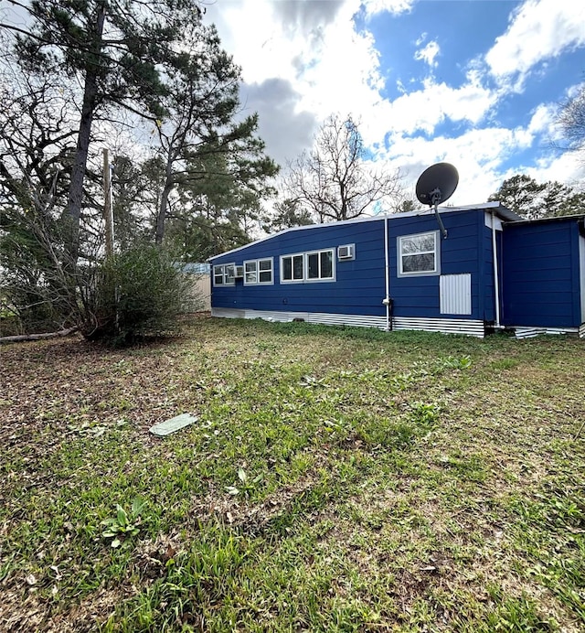 view of home's exterior featuring a yard