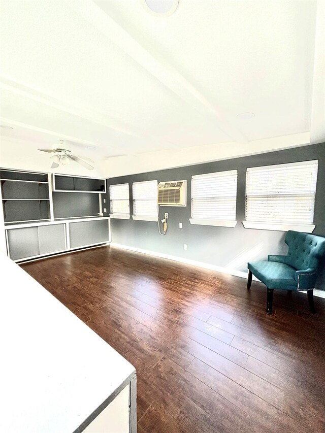 interior space featuring ceiling fan, a wall mounted air conditioner, and hardwood / wood-style flooring