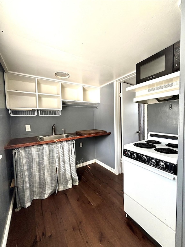 kitchen with white range, dark hardwood / wood-style floors, extractor fan, and sink