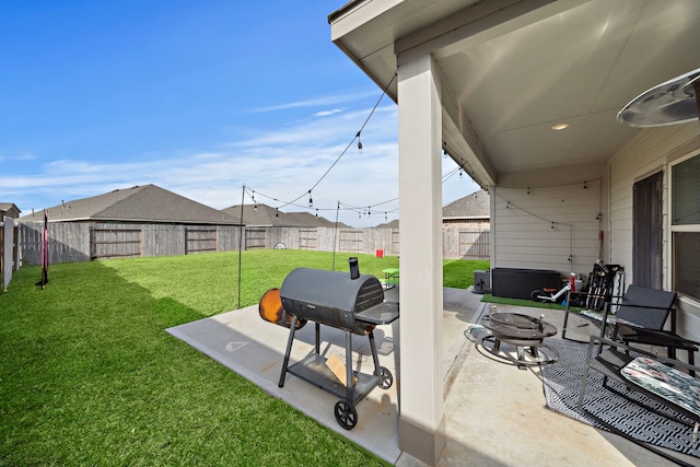 view of patio / terrace with a fire pit and a grill