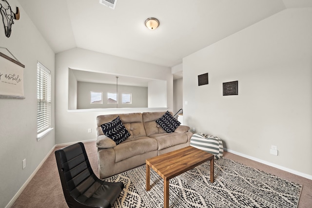 living room featuring carpet floors and lofted ceiling