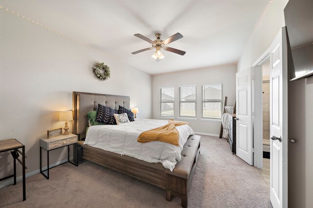 bedroom featuring light carpet and ceiling fan