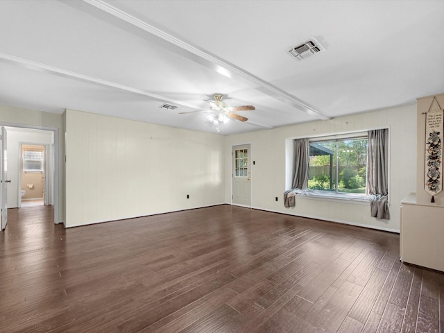 unfurnished living room with ceiling fan and dark wood-type flooring