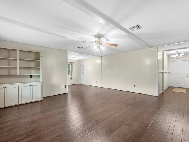 unfurnished living room with dark hardwood / wood-style flooring and ceiling fan with notable chandelier