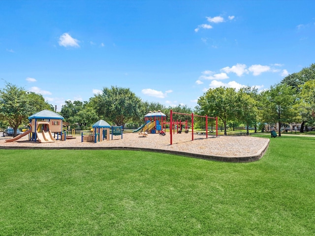 view of playground with a lawn