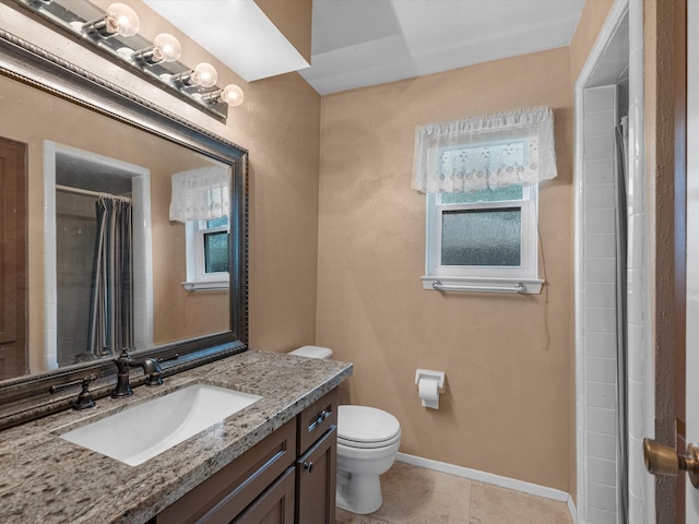 bathroom with tile patterned flooring, vanity, a shower with shower curtain, and toilet