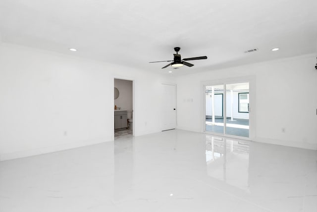 empty room with ceiling fan and ornamental molding