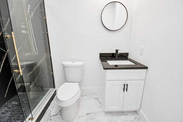 bathroom with a shower with door, vanity, and toilet